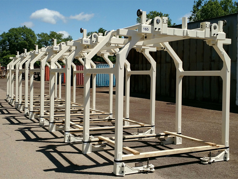 A row of overhead carriers outside the shop