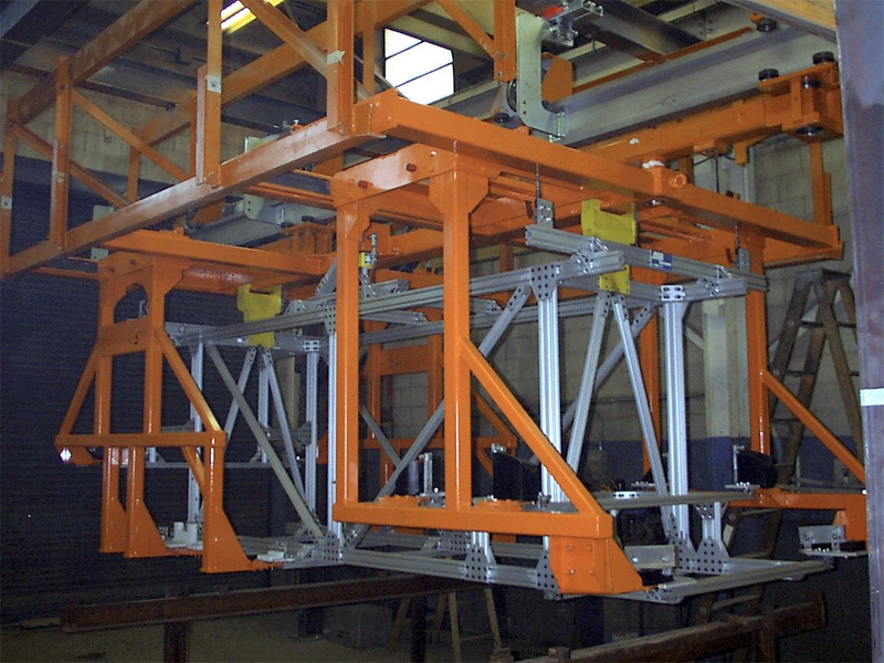 Orange overhead carrier frame in the weld shop